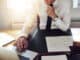 Business man working at office with laptop and documents on his desk