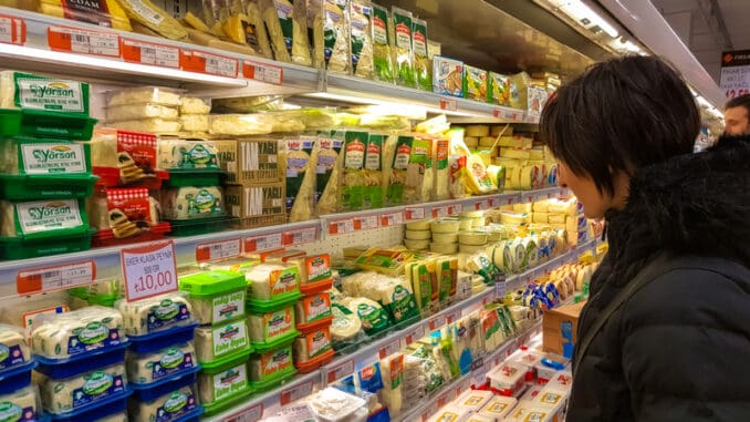 Young brunette woman shopping in supermarket