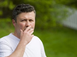 Portrait of a handsome middle eastern man smoking